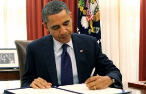 Obama_signing_bill